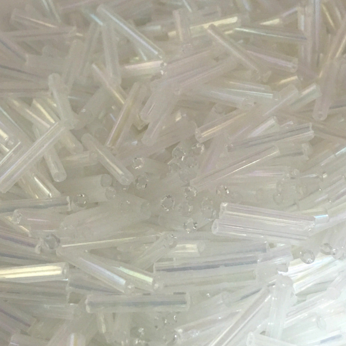 Clear - 12mm Rainbow (50g) - Bugle Seed Beads