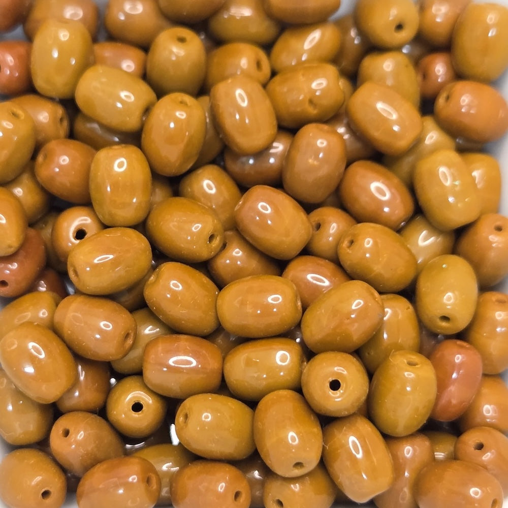 Close-up of brown-colored beads with a glossy finish.