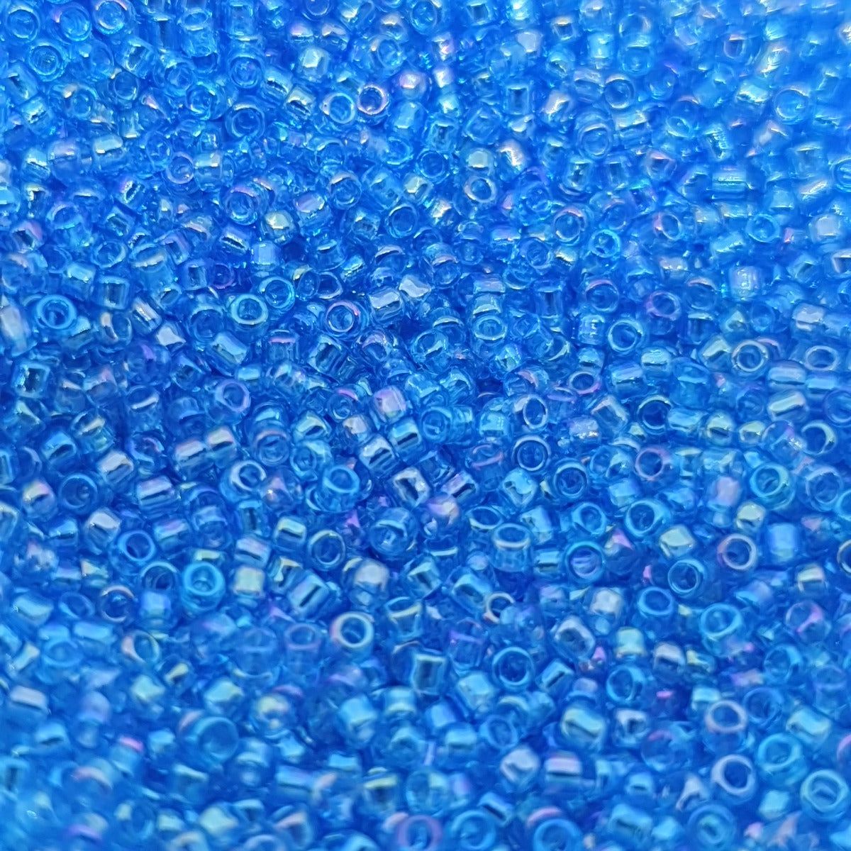 15/0 (545r) Aqua Transparent Rainbow - 10g Tube