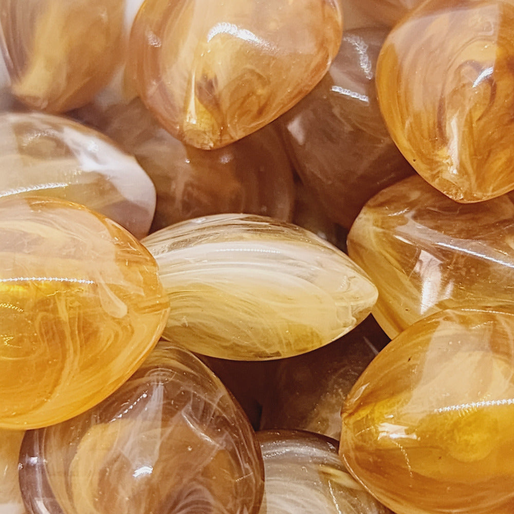 jasper brown gemstone style acrylic beads with visible threading holes for crafting jewelry on a white background