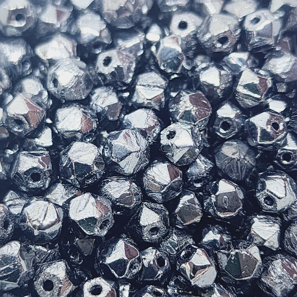 gunmetal grey facet beads in a group