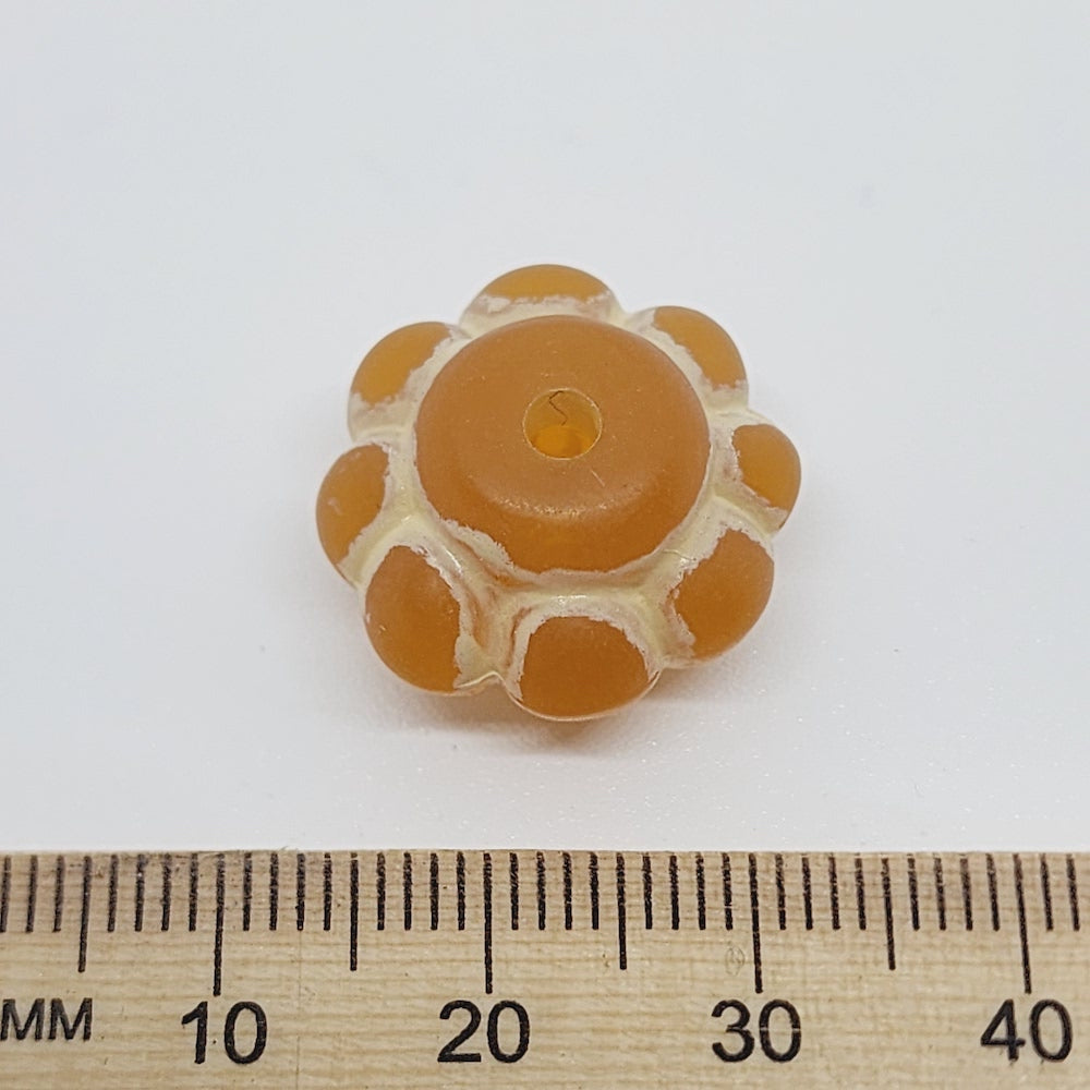 baroque vintage transparent orange wheel pumpkin shape beads with intricate orange and white designs showing visible holes for threading jewelry and earrings next to a ruler to show size