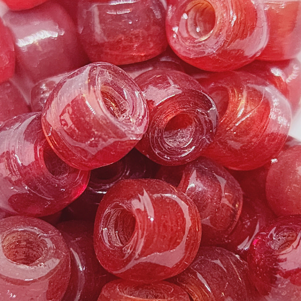 A collection of authentic glass Indian pony beads showing large holes for the purpose of making jewelry or decorations