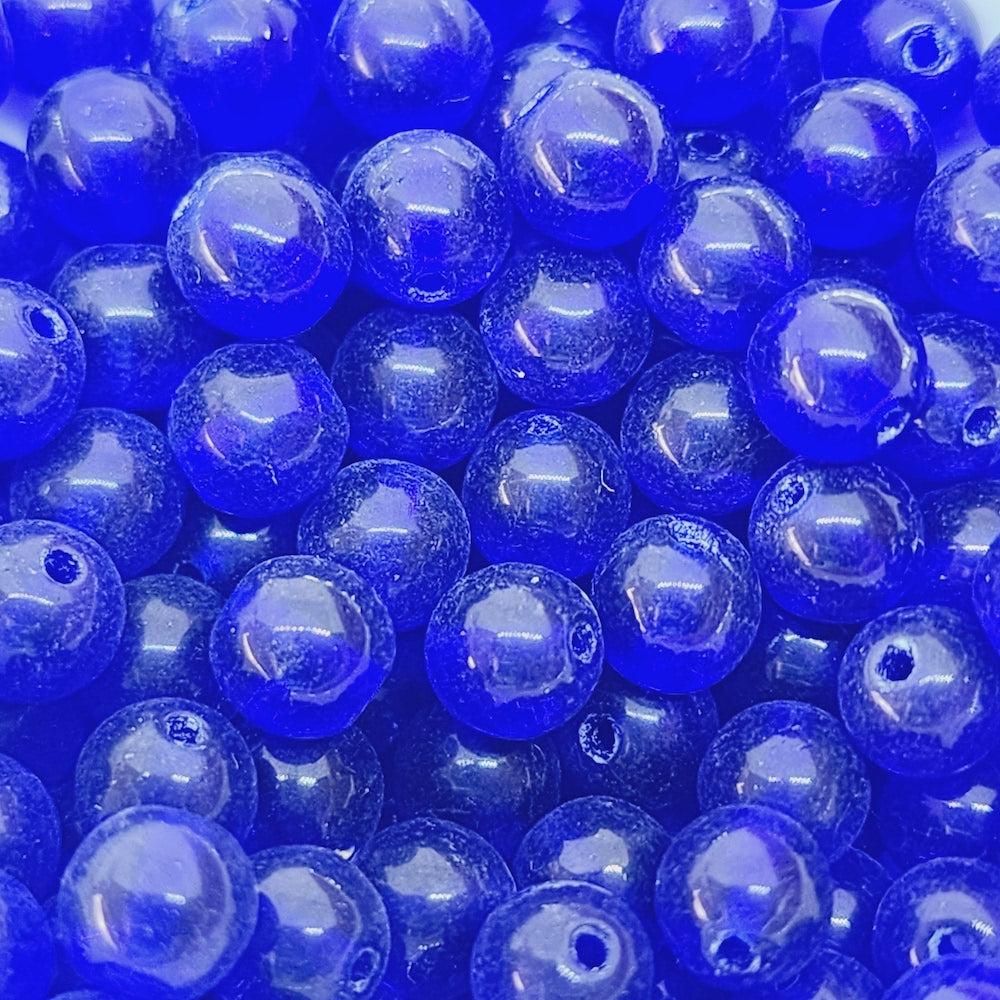 dark blue round glass beads in a collection