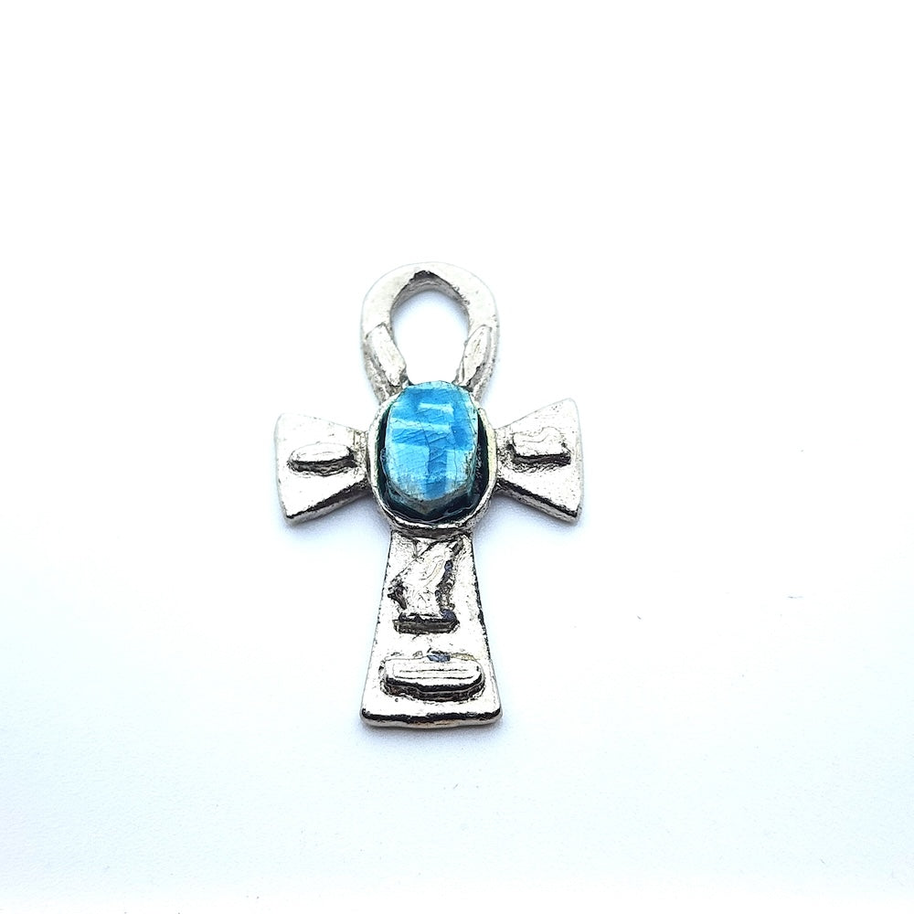 Metal Ankh vintage charm with turquoise blue tiny scarab beetle in the centre on a white background