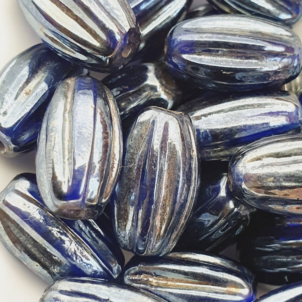 16x10mm Grooved Oval (25) - Transparent Sapphire Blue w. Gunmetal Lustre - Indian Glass Vintage Beads