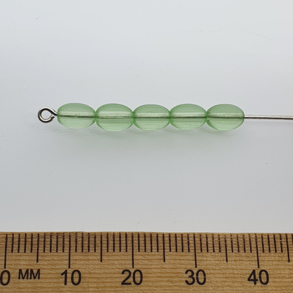 7x4mm Rice (100) - Transparent Peridot Green - Glass Bead