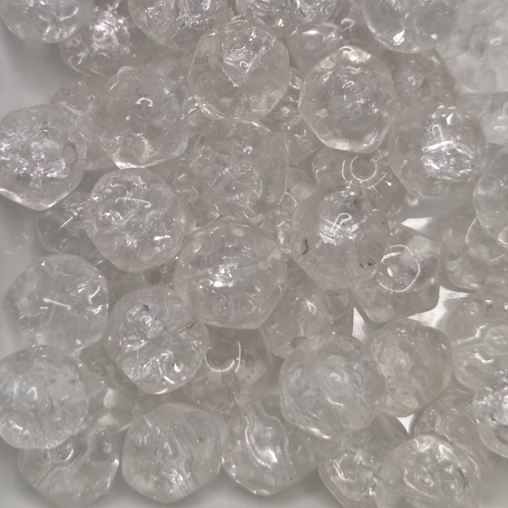Close-up of clear crackle effect glass beads on a white background