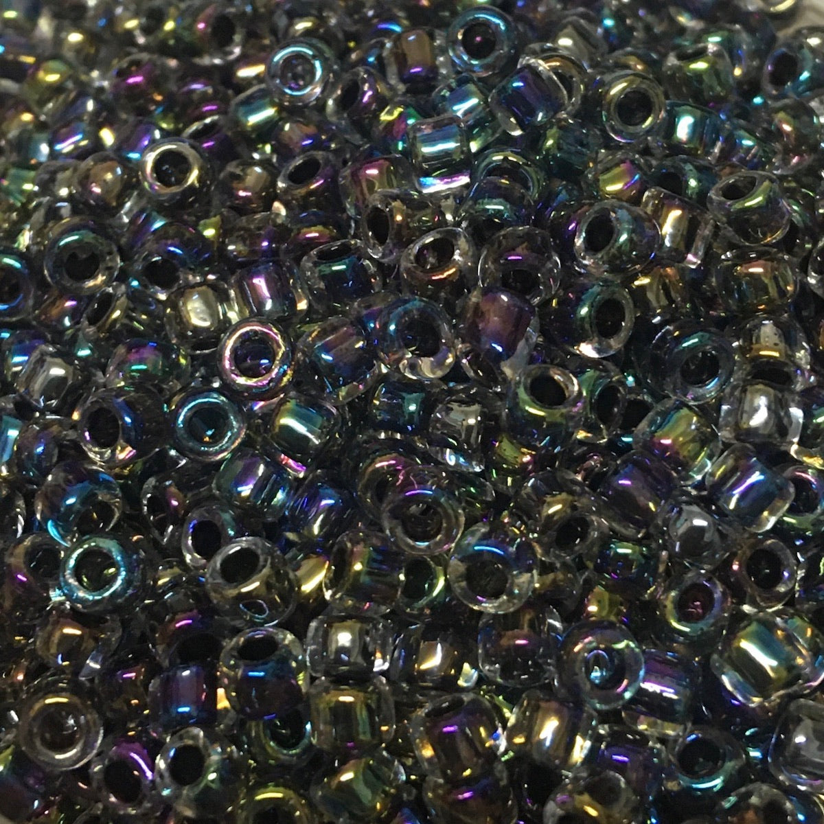 6/0 (#324) Black Rainbow Lined Transparent - 20g Tube - Bead Shack