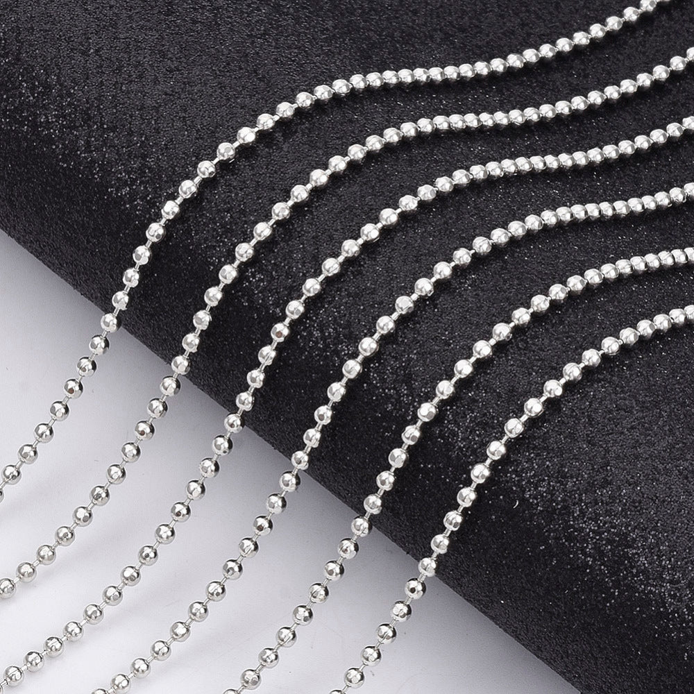 Ball chain laid out separately on a white and black background