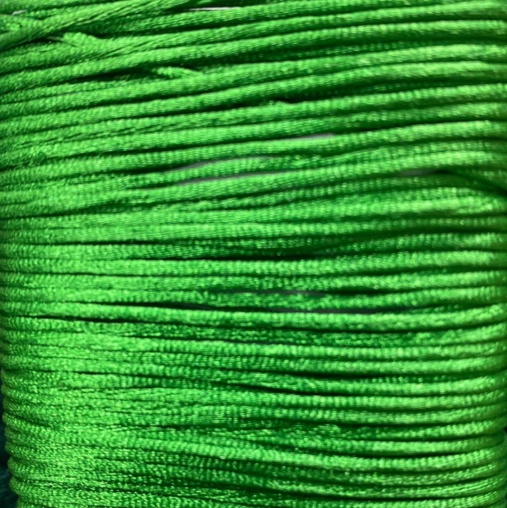 A close-up image of a green colored rat tail cord used for crafting.