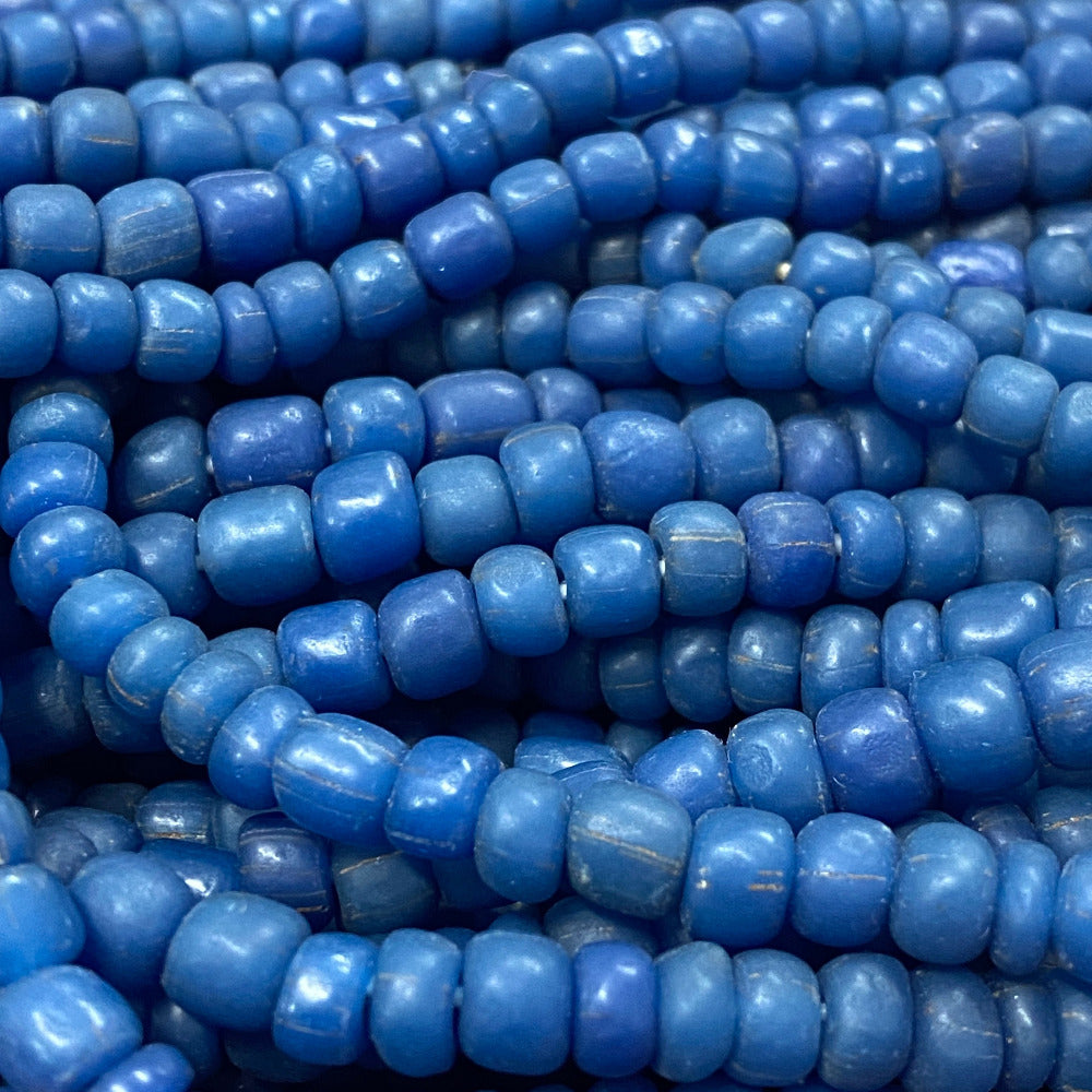 Close-up of blue glass beads stacked together