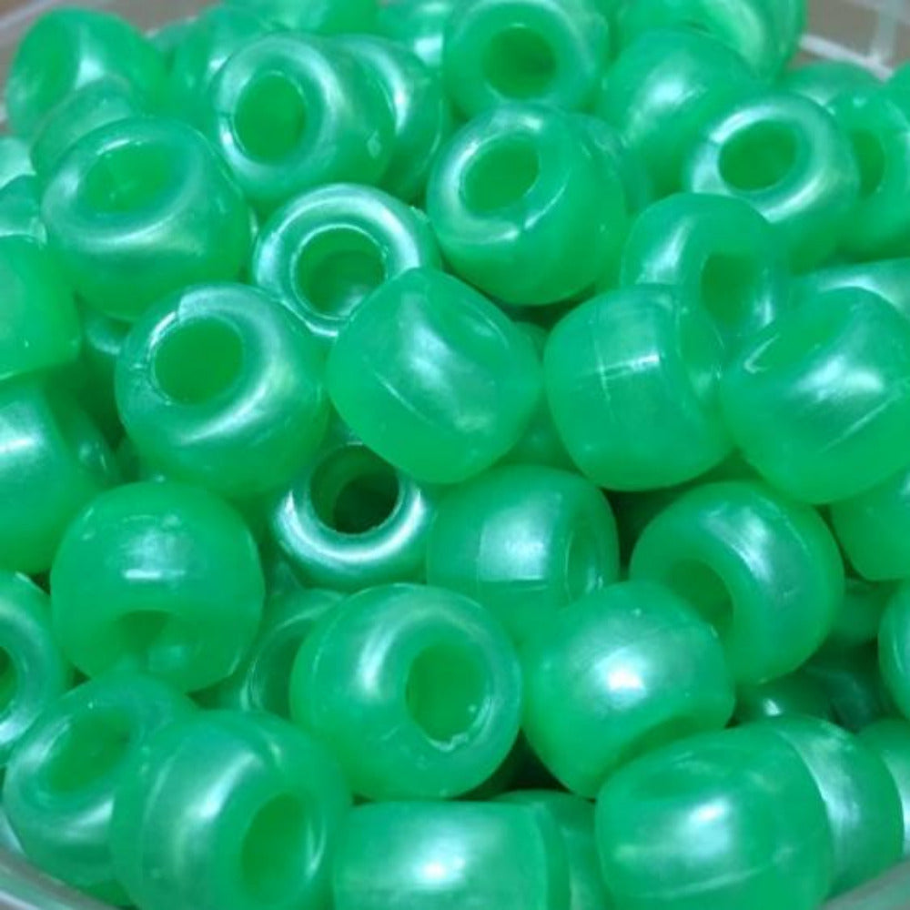 A close-up image of pearlized acrylic pony beads.