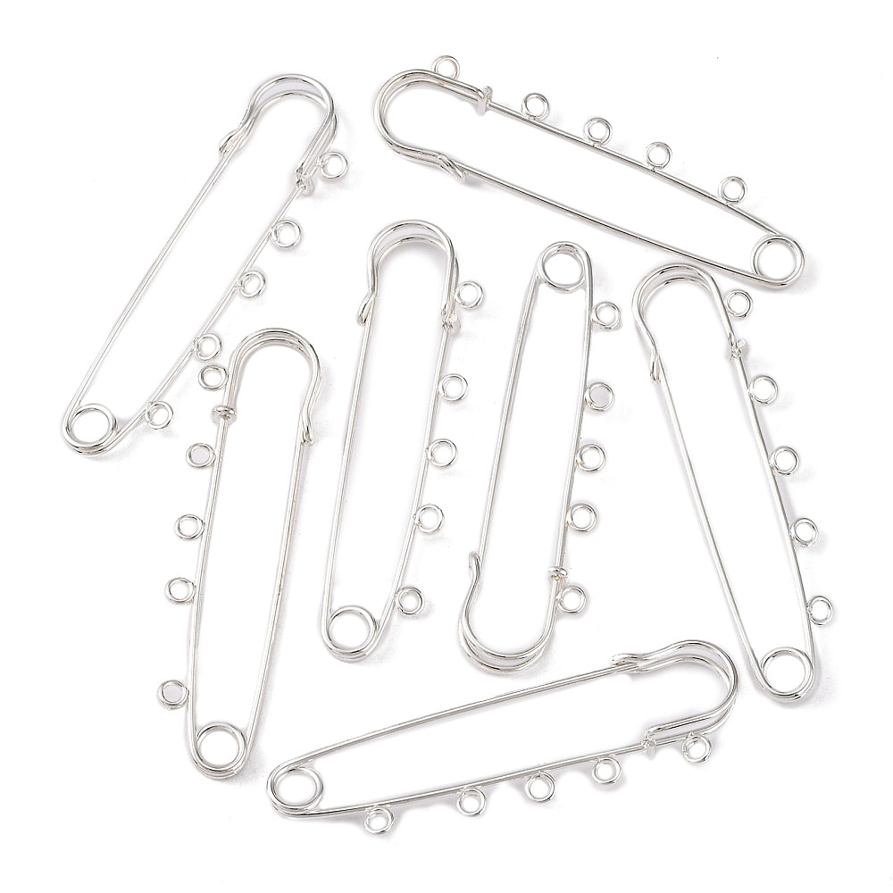 Kilt Pins in silver tone with 5 loops for threading beads and charms on a white background