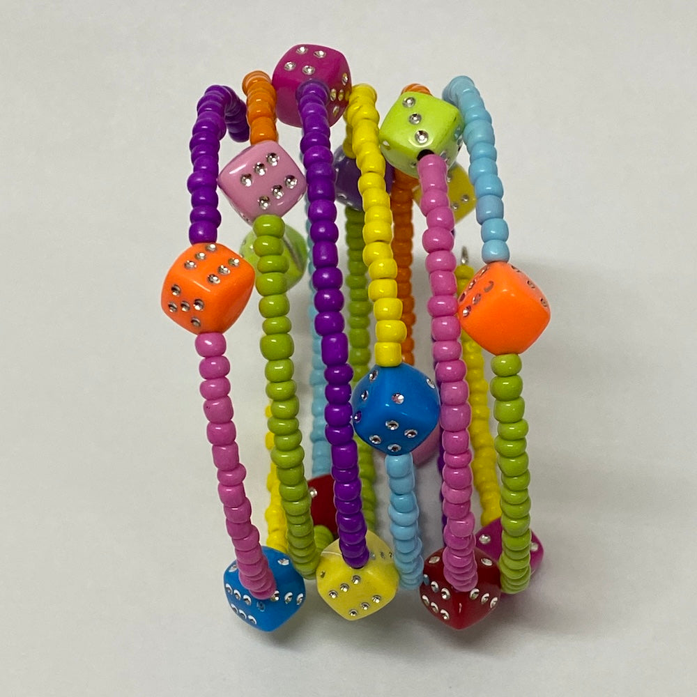 A multicolored beaded bracelet with six loops, featuring colorful seed beads and small dice-shaped beads.