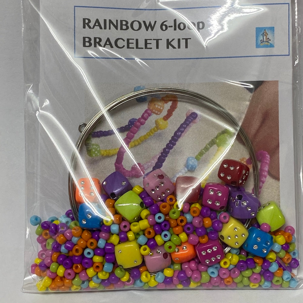 Packaged rainbow 6-loop bracelet kit with colorful beads and a clear plastic cover.