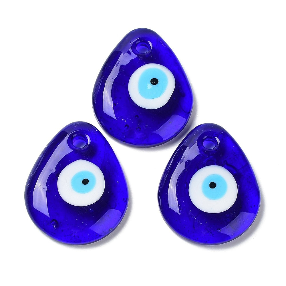 Three blue teardrop-shaped evil eye glass pendants on a white background