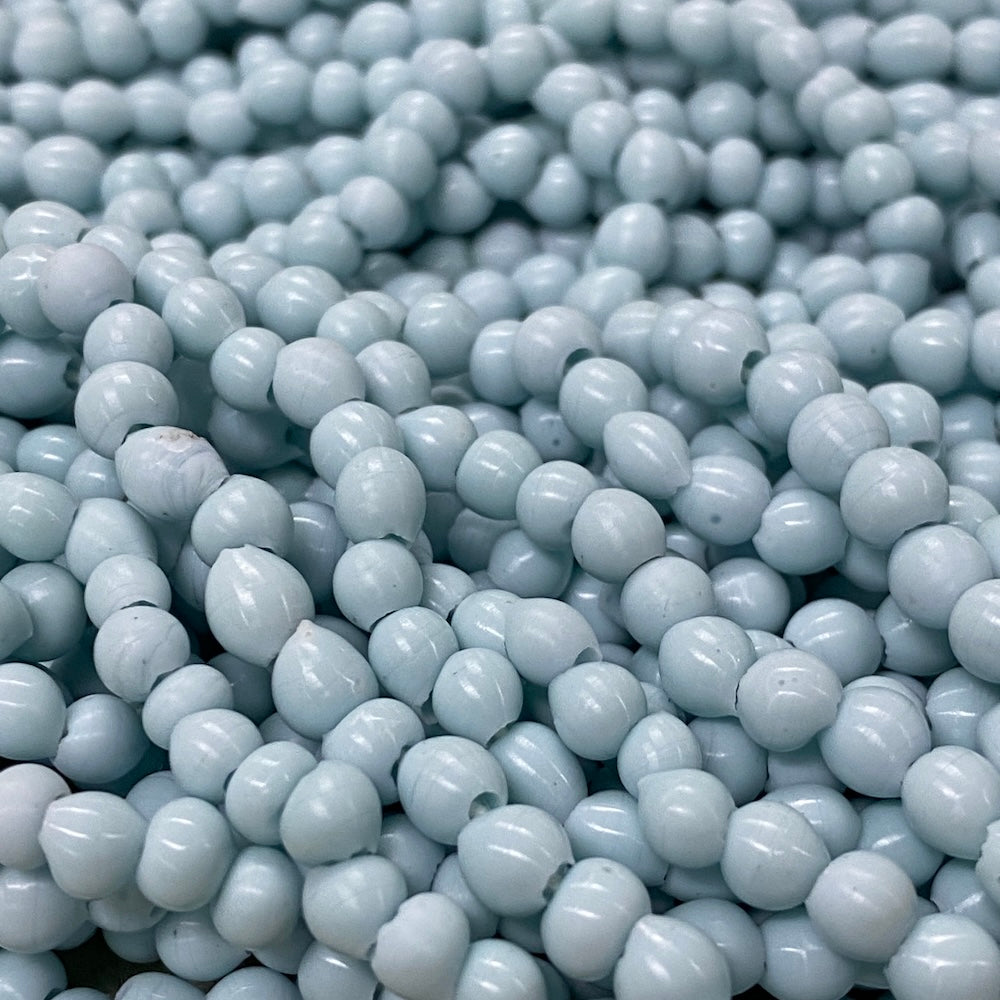 Close-up of light blue beads