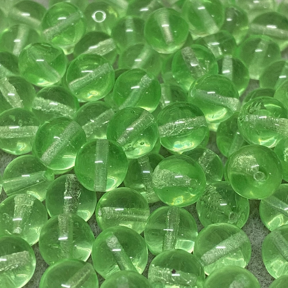Close-up of green vintage vaseline glass beads