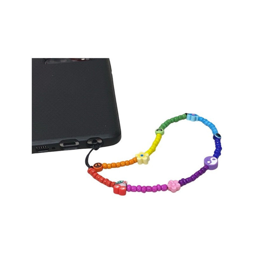 A multicolored beaded mobile phone charm lanyard with various shapes and sizes of beads attached to a mobile phone.