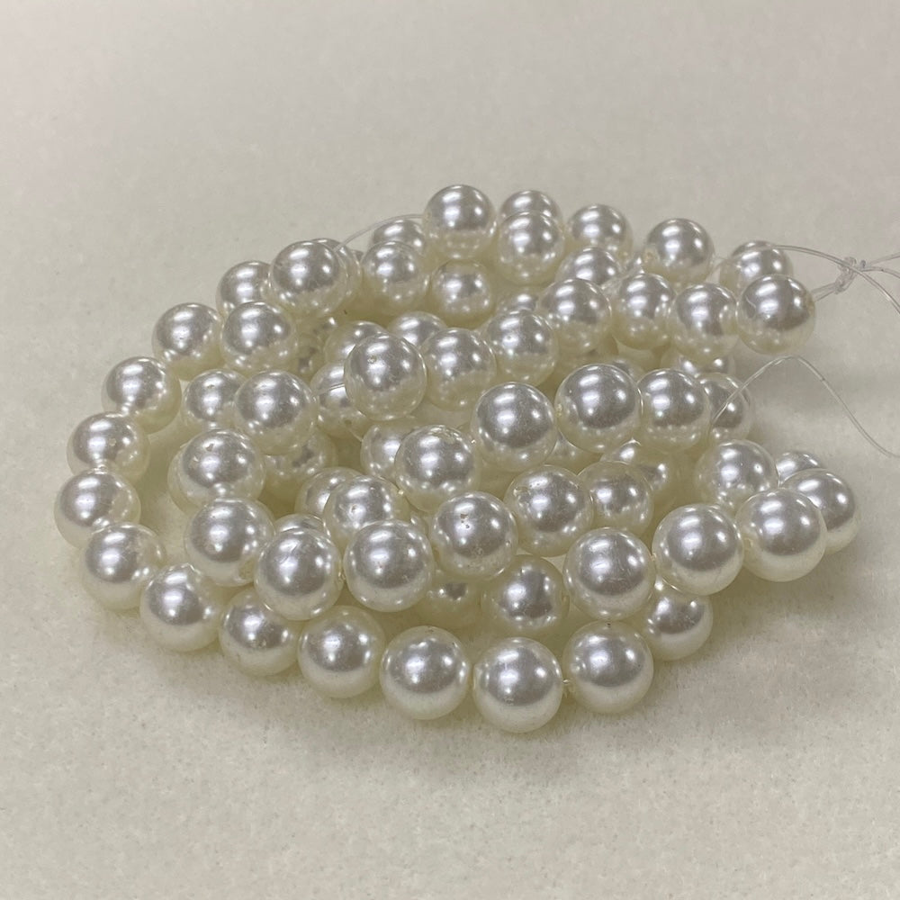 String of pearls on a light gray background