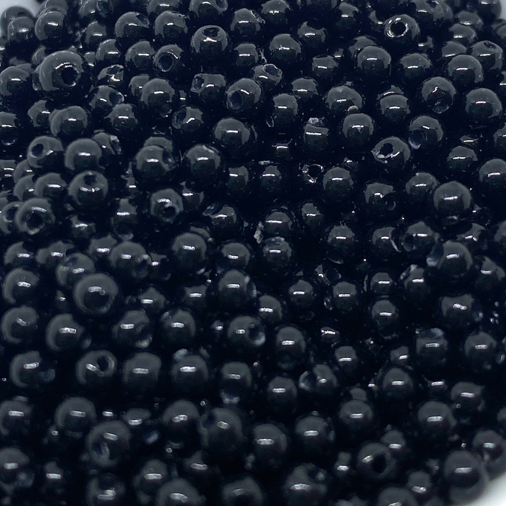 Close-up of black beads stacked together