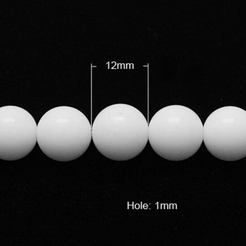 White spherical beads with a 1mm hole and measurement details on a black background