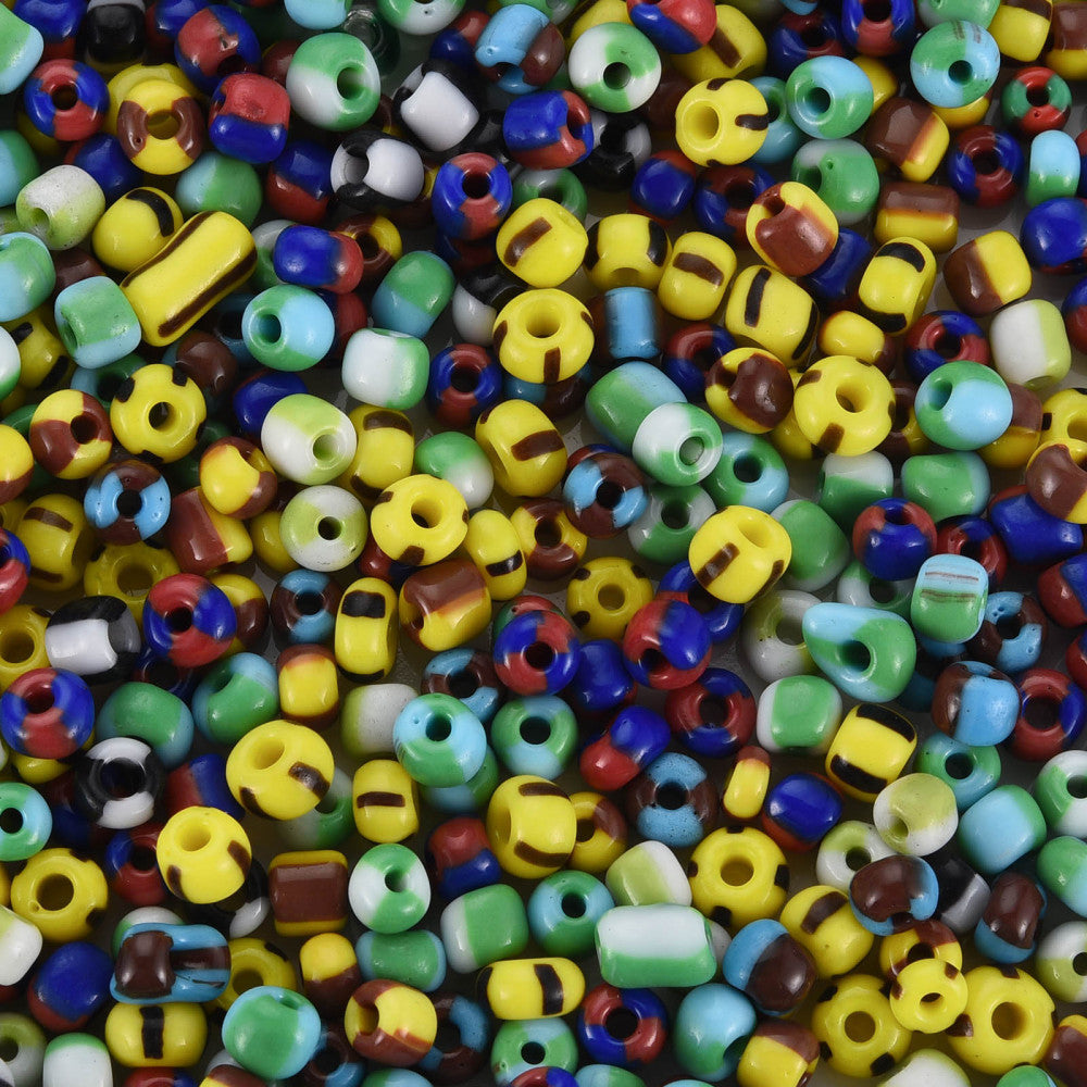 Colorful assortment of glass seed beads with various shapes and sizes.