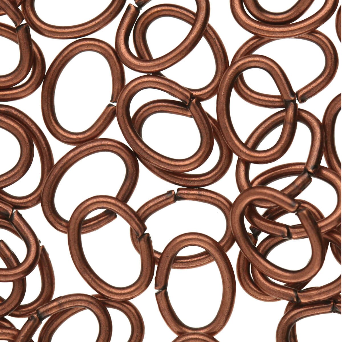 Close-up of copper jump rings on a white background