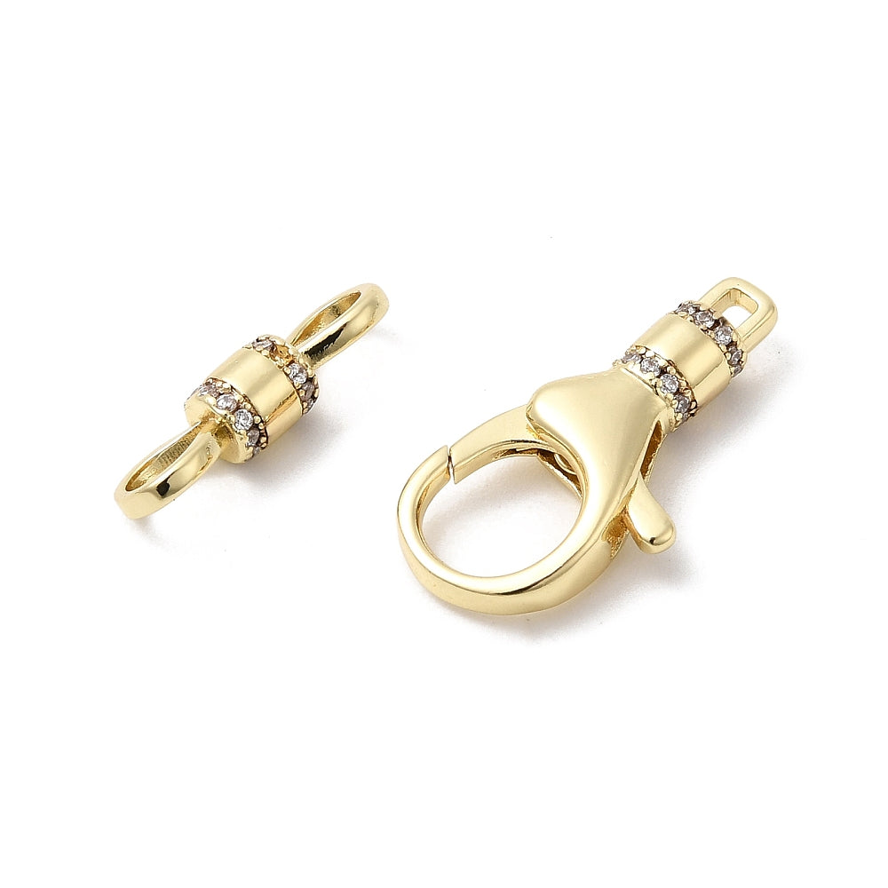 Gold jewelry clasp with diamond accents on a white background