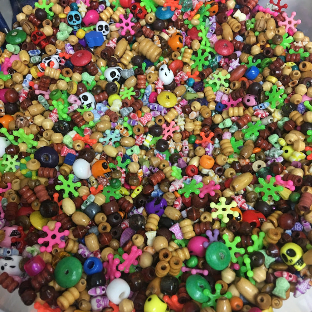 random assortment of plastic and wood beads for children craft and jewelry making