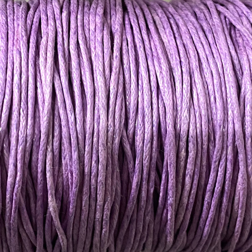 Close-up of light purple wax cotton strands