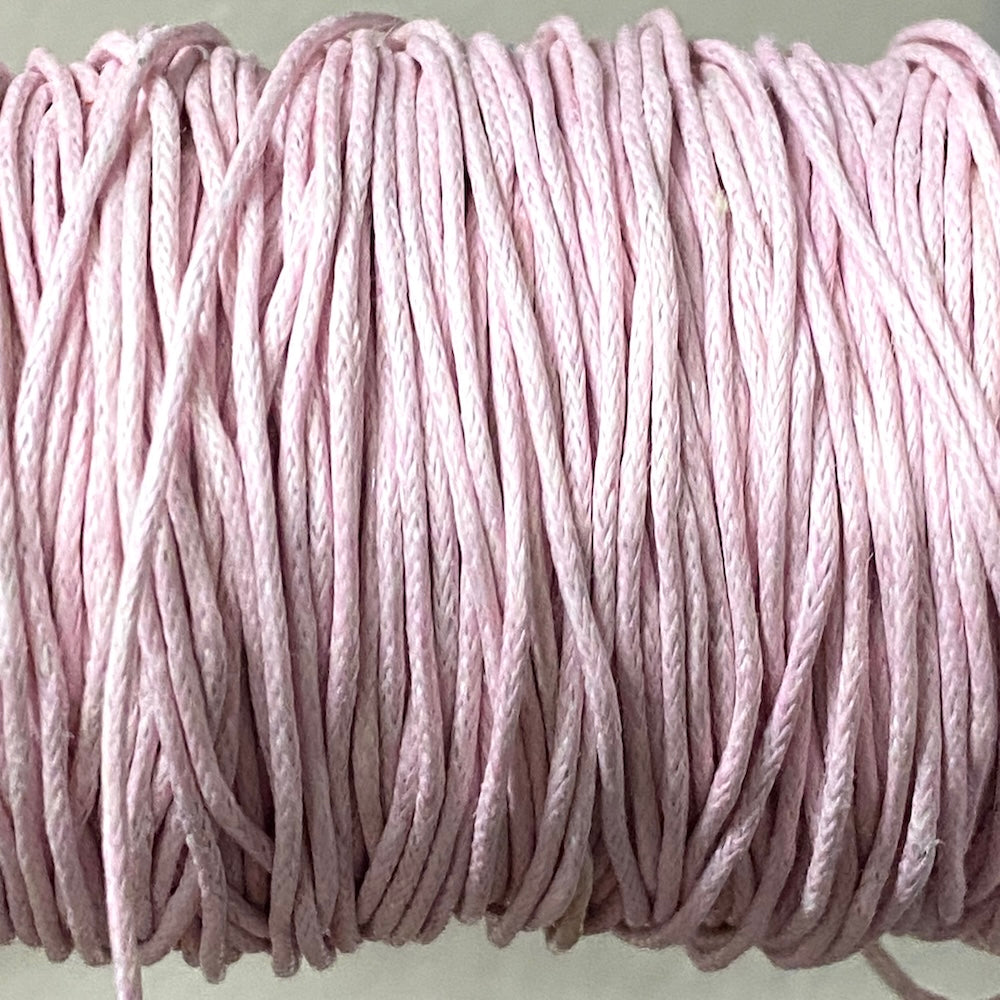 Close-up of light pink wax cotton strands