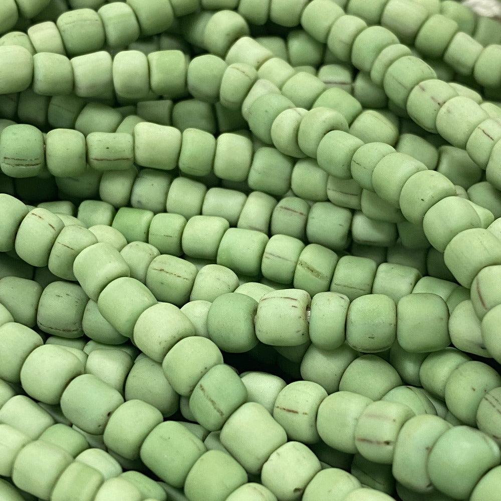 Close-up of green beads stacked together