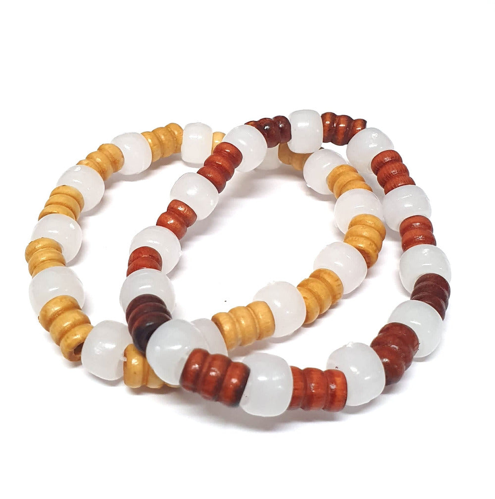 2 handmade uv bracelets for experiments in the sun by children made from a kit