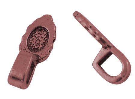 tibetan look metal oval bails with patterning for the glue to hold on a white background