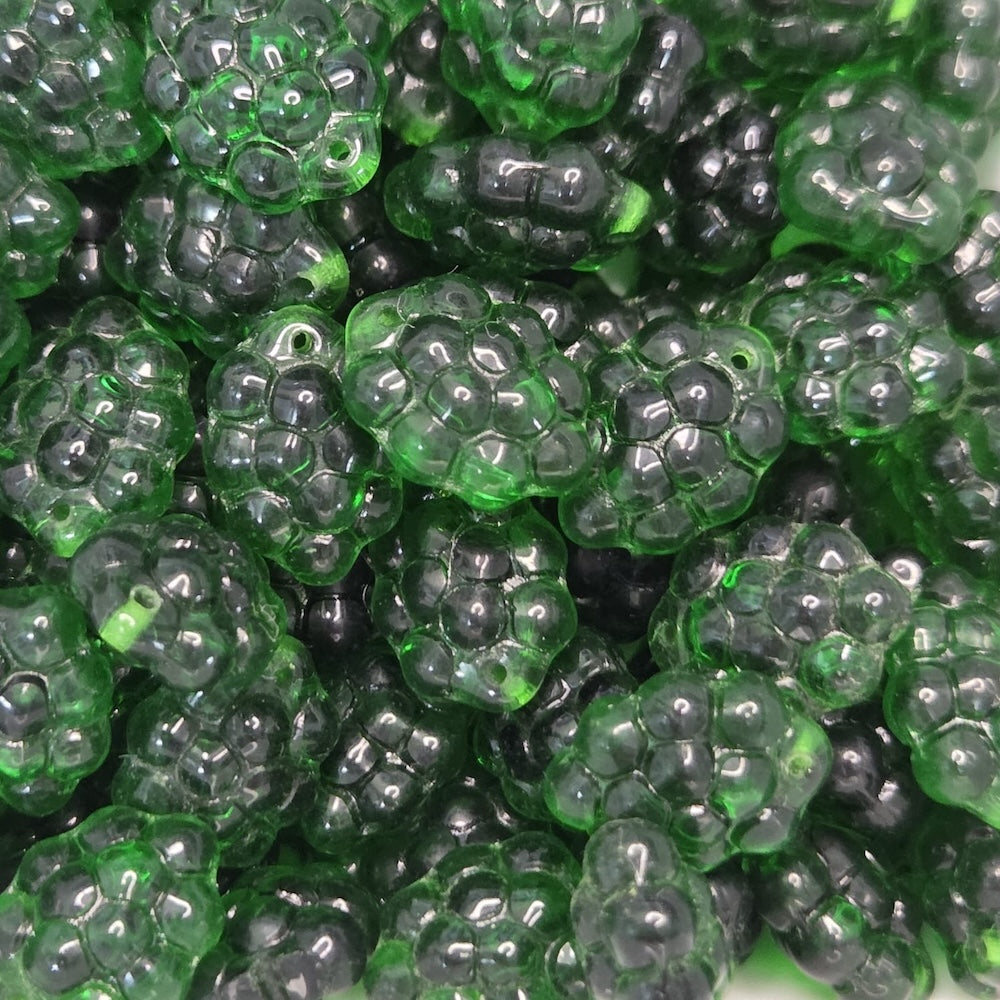 bunch of grape style green beads in a group with a hole for threading for jewelry or craft