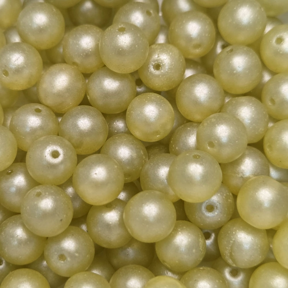 Close-up of pale yellow pearls with a soft focus