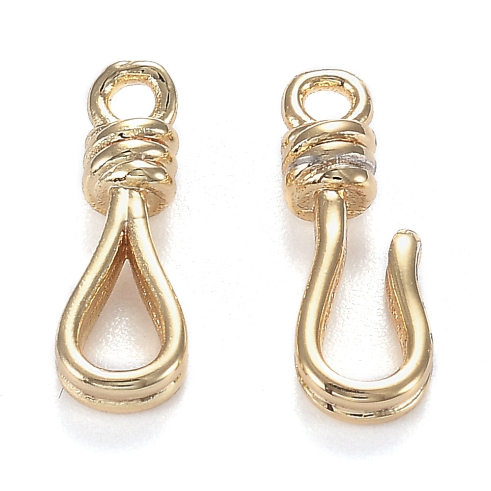 Two gold hooks on a white background