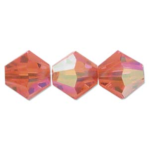 Three multicolored hexagonal beads on a white background
