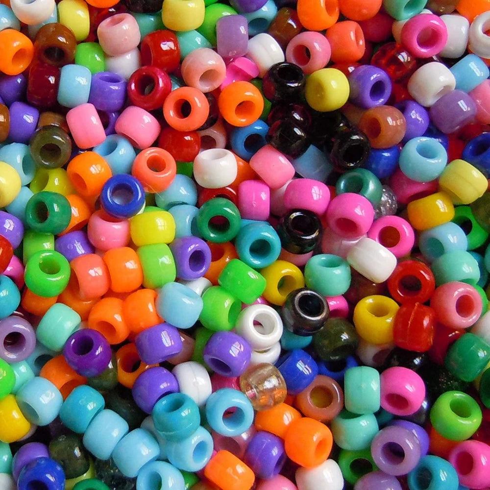 a collection of colorful large hole plastic pony beads for the purpose of making craft and jewelry