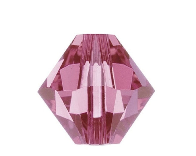 Pink crystal facet bead on a white background