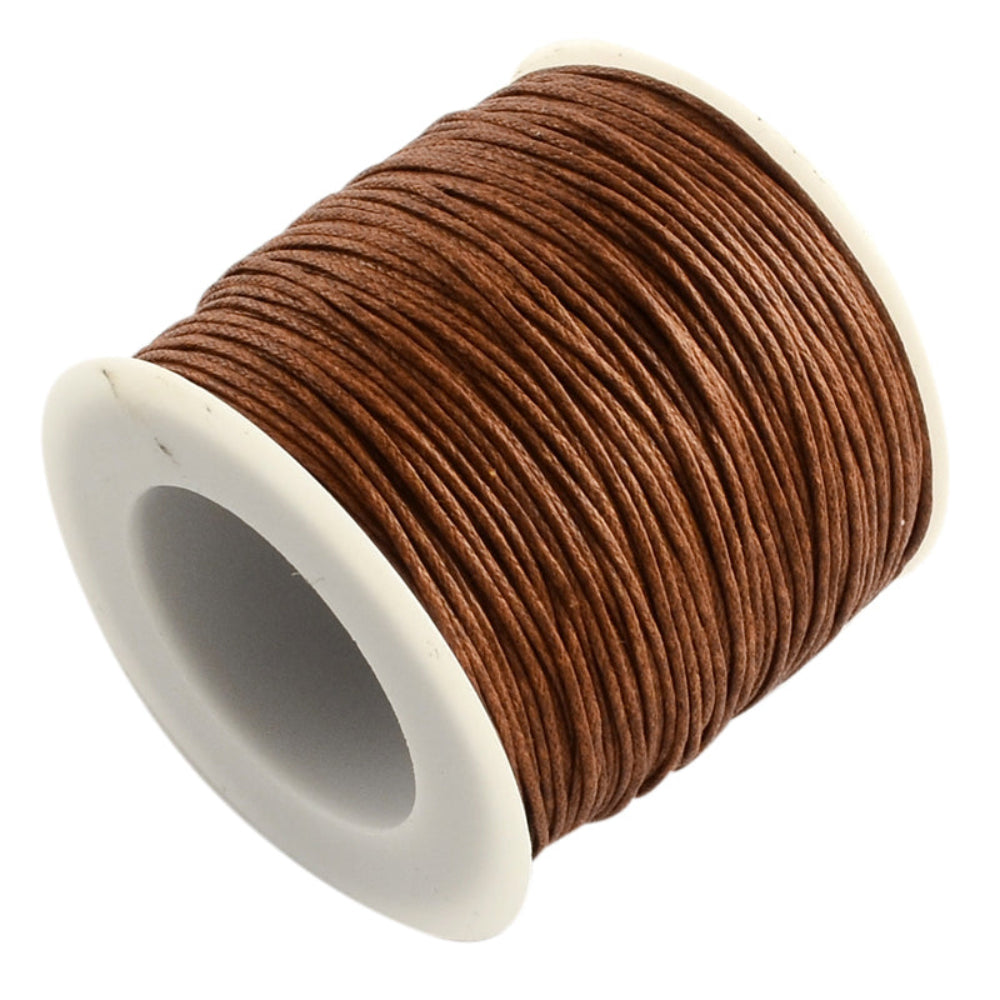 A spool of brown wax cotton cord used for crafting and jewelry making.
