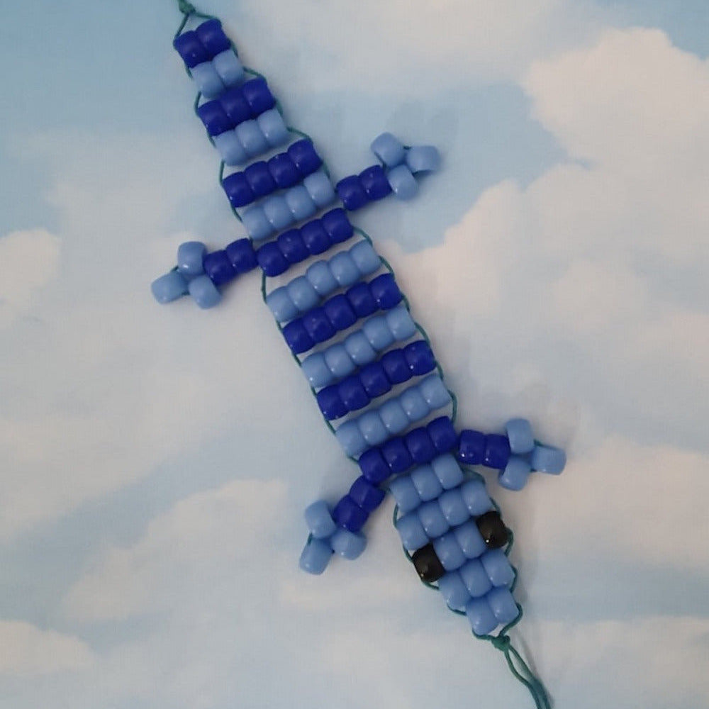 blue beaded blue tongue lizard toy made at Bead Shack snakes & lizard birthday party on a white background