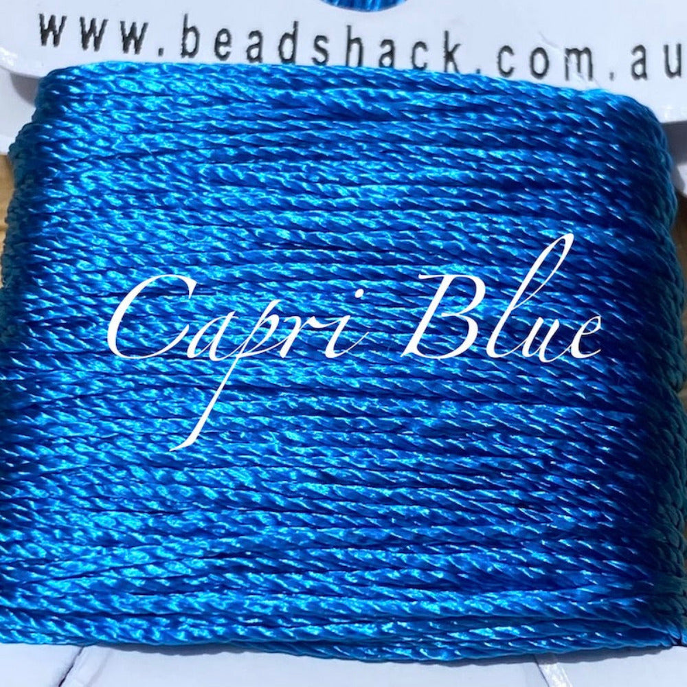 A close up photo of silky thread showing the textured surface used for the purpose of sewing craft and jewelry stringing