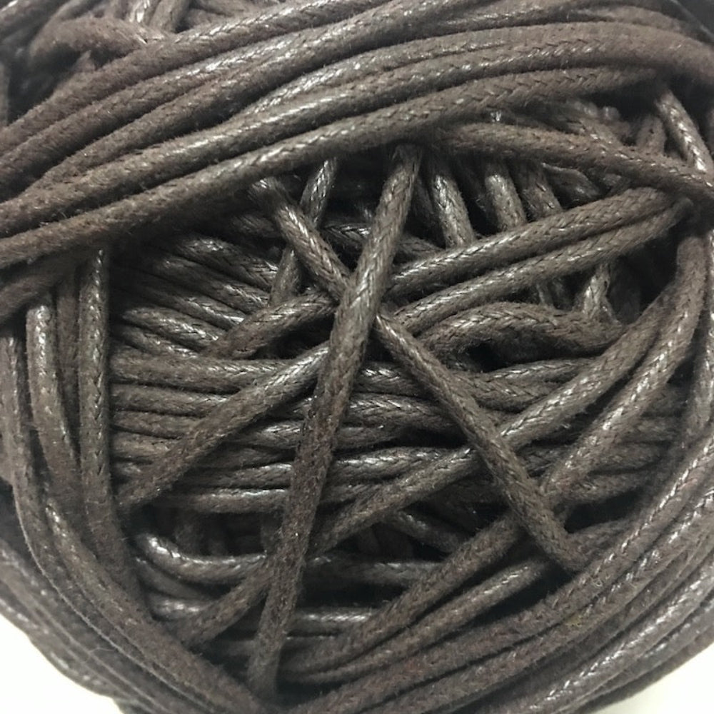 A close-up image of a chocolate brown wax cotton cord.