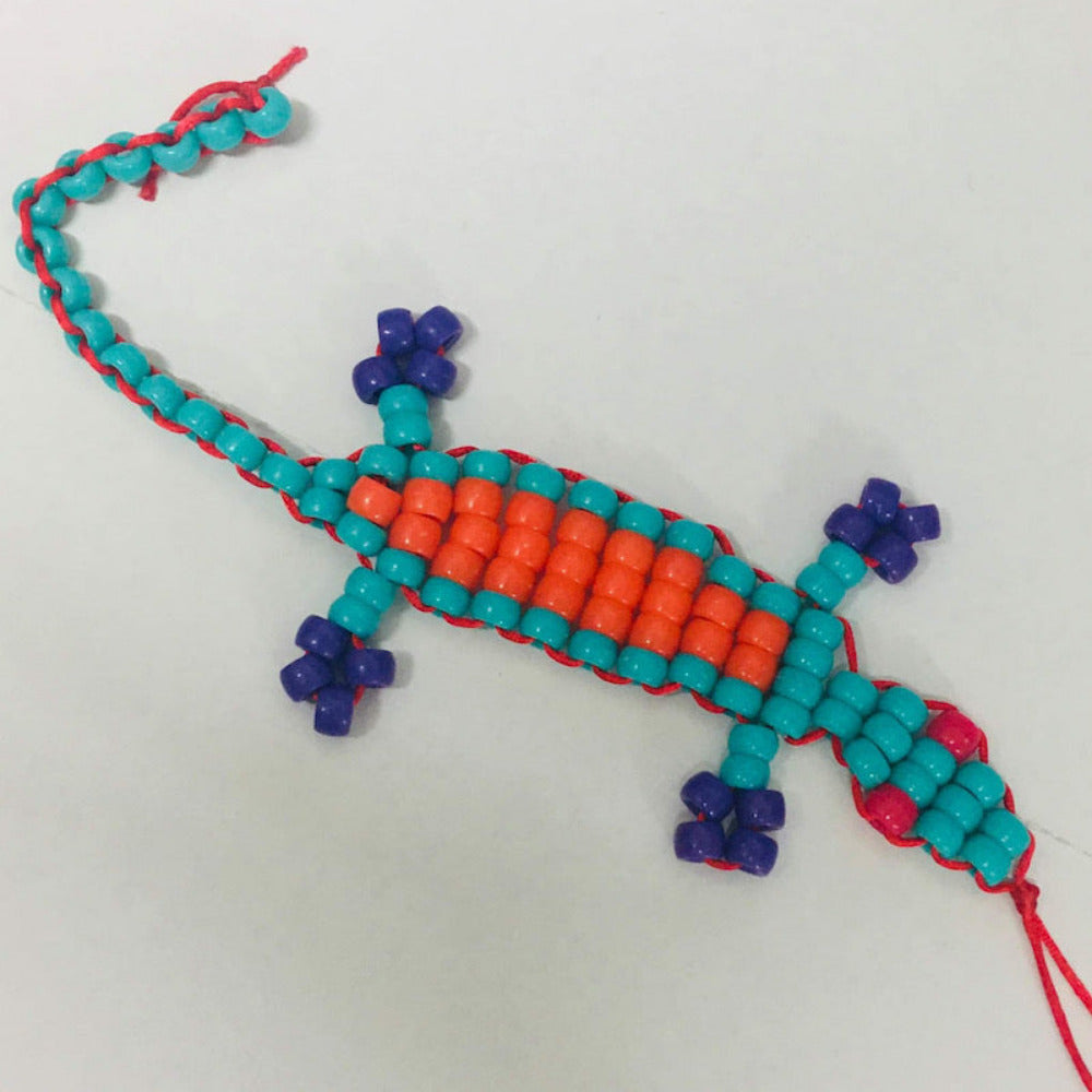 colourful beaded gecko toy made at Bead Shack snakes & lizard birthday party on a white background