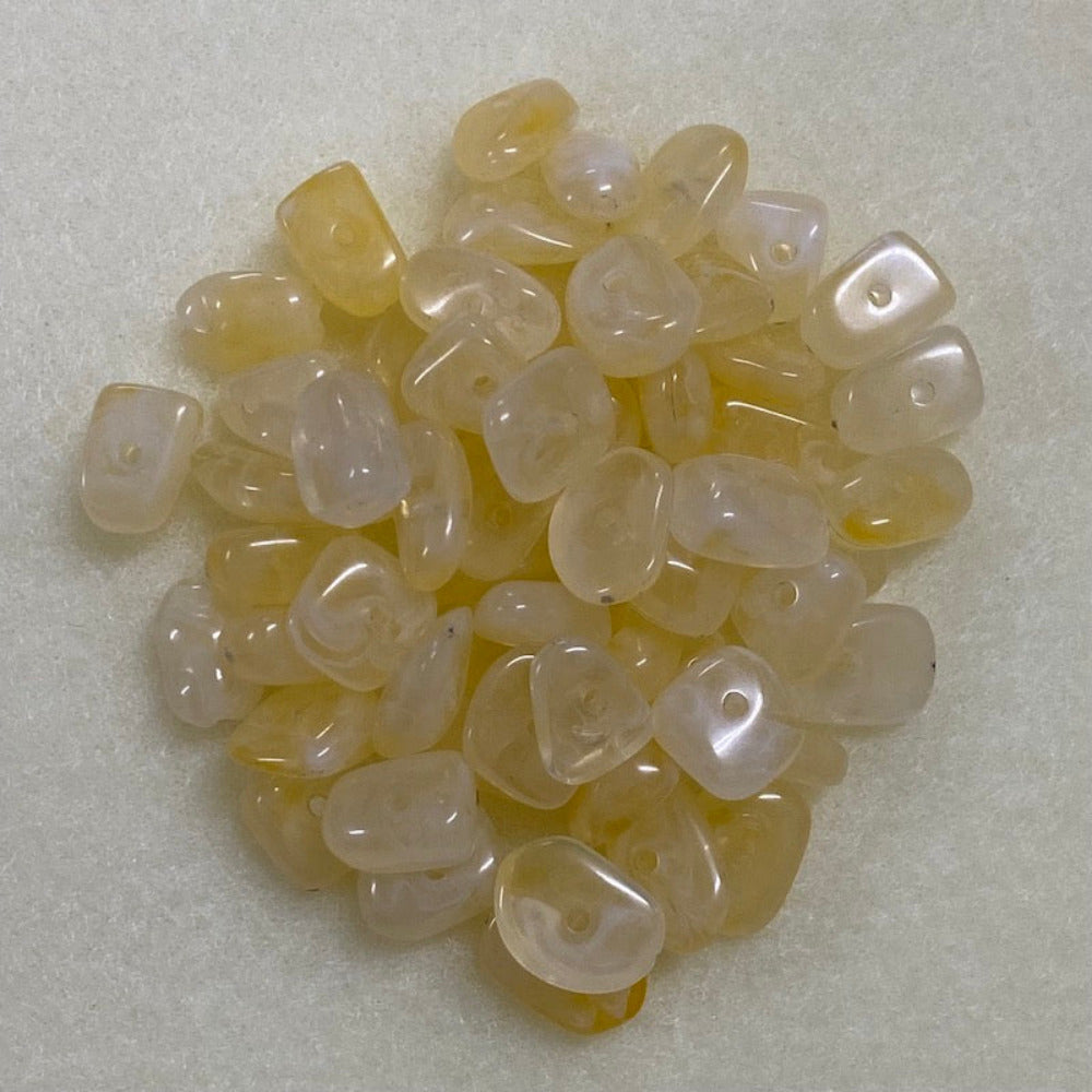 Citrine yellow gemstone style acrylic beads resembling real gemstones, with visible threading holes for crafting jewelry on a white background, used for crafting and jewelry making.