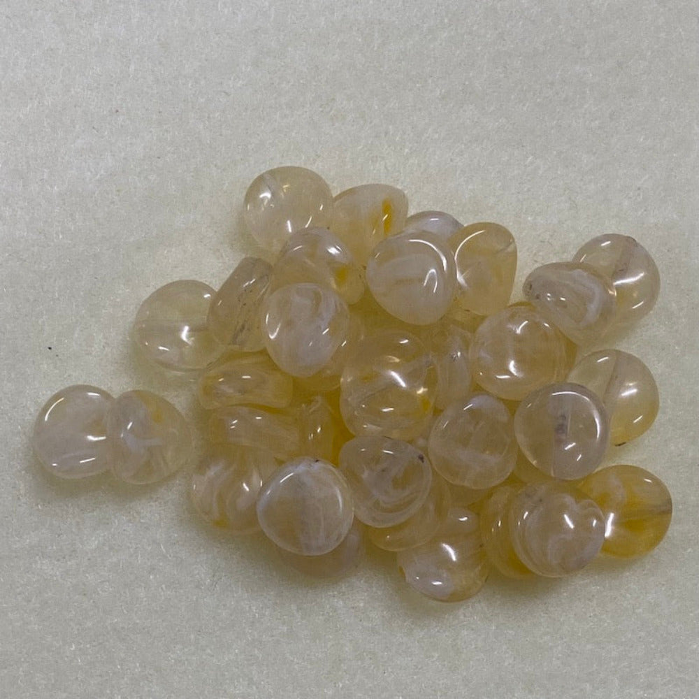 Citrine yellow gemstone style acrylic beads resembling real gemstones, with visible threading holes for crafting jewelry on a white background, used for crafting and jewelry making.