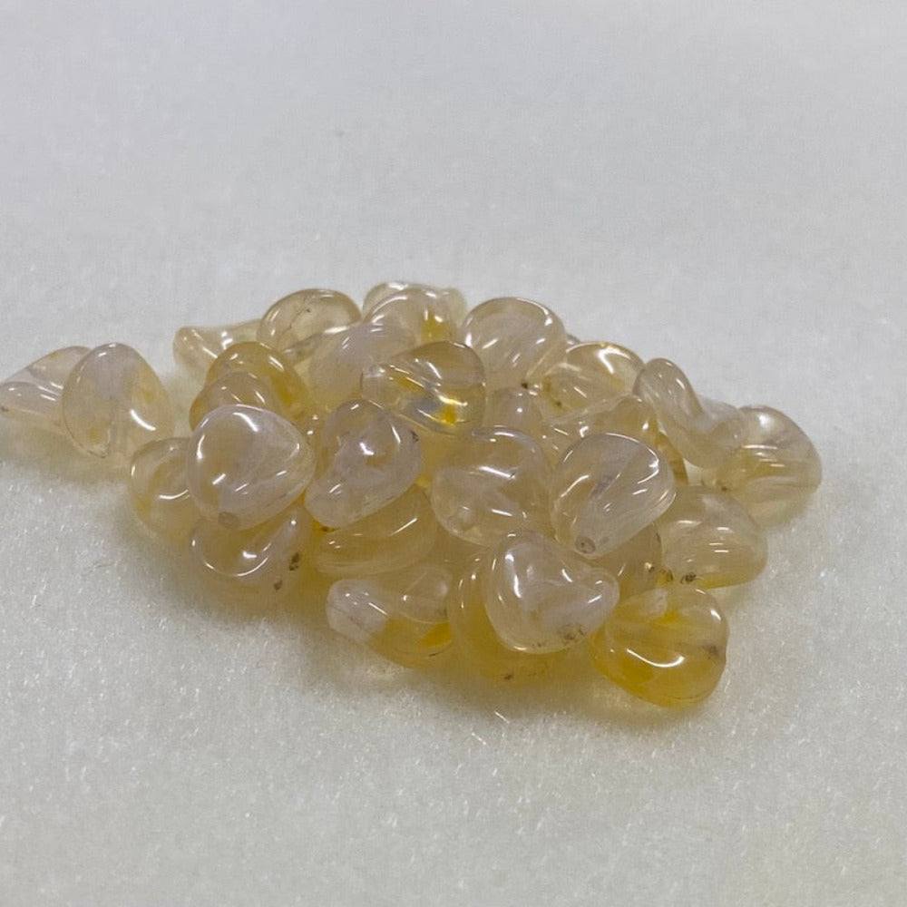 Citrine yellow gemstone style acrylic beads resembling real gemstones, with visible threading holes for crafting jewelry on a white background, used for crafting and jewelry making.